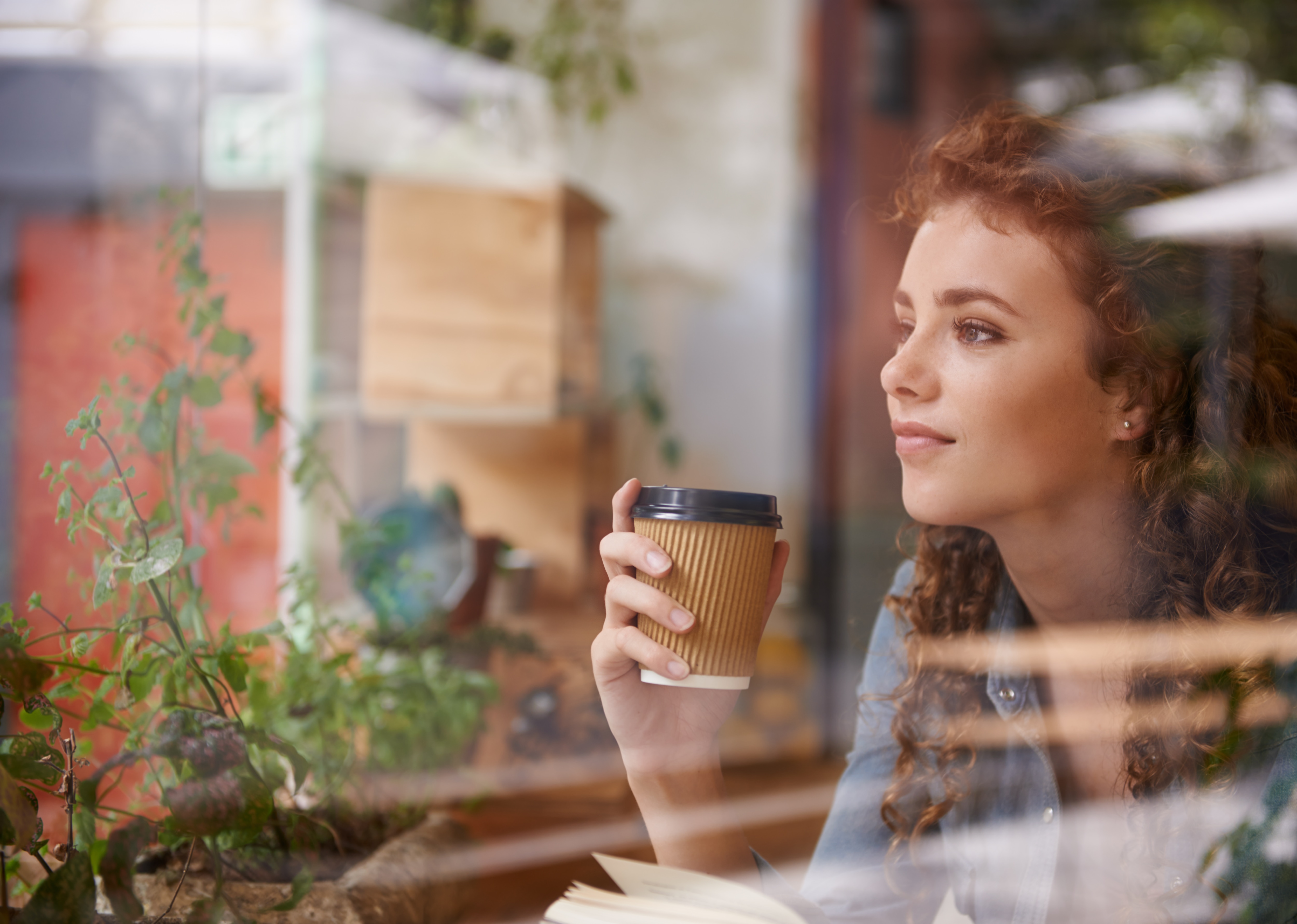 woman looking out the window