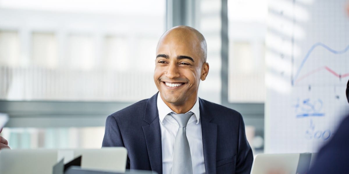 man smiling in office