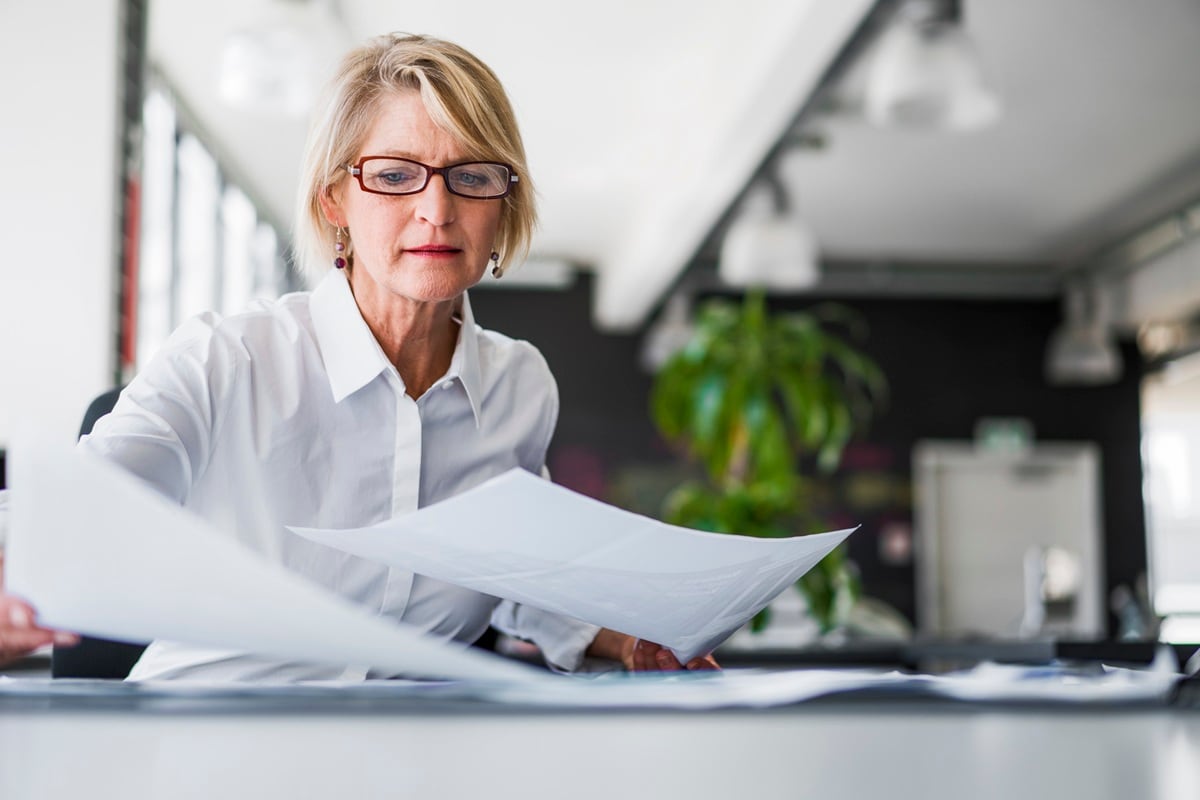 Lady sitting at desk with paperwork